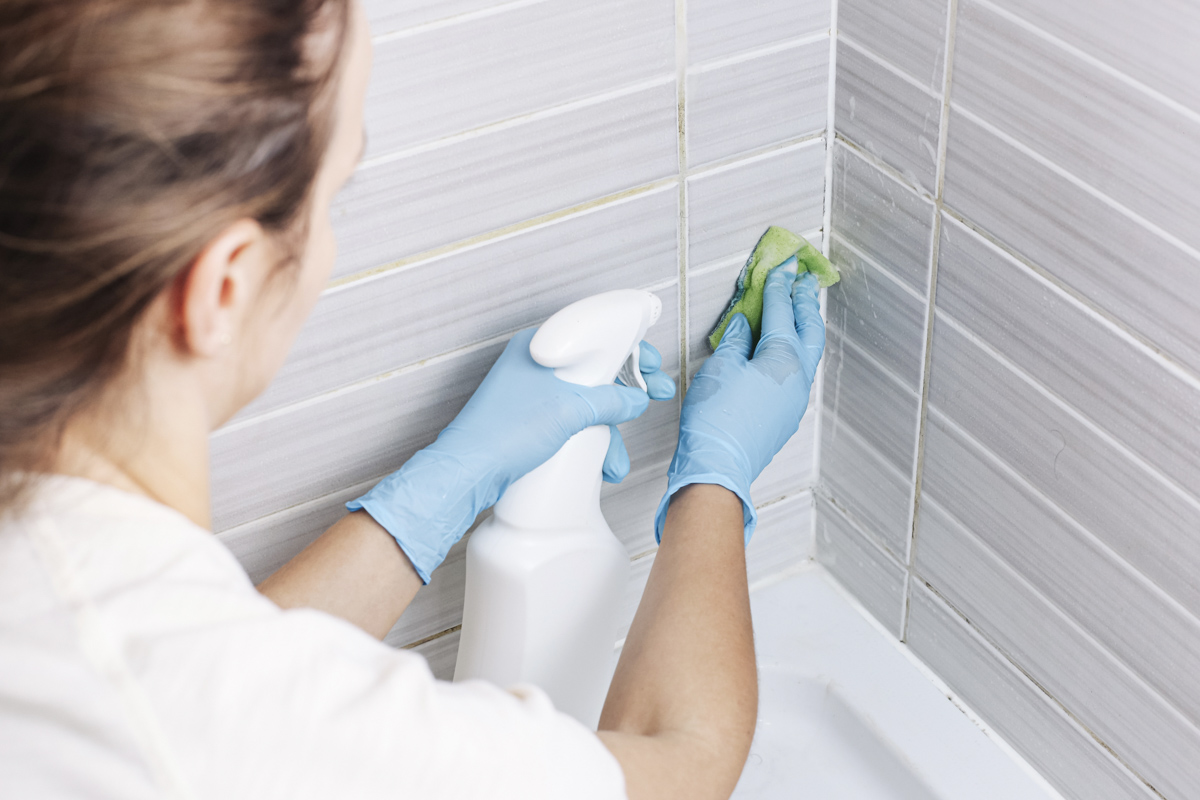 Cleaning tile grout in a small bathroom before remodel cost estimate