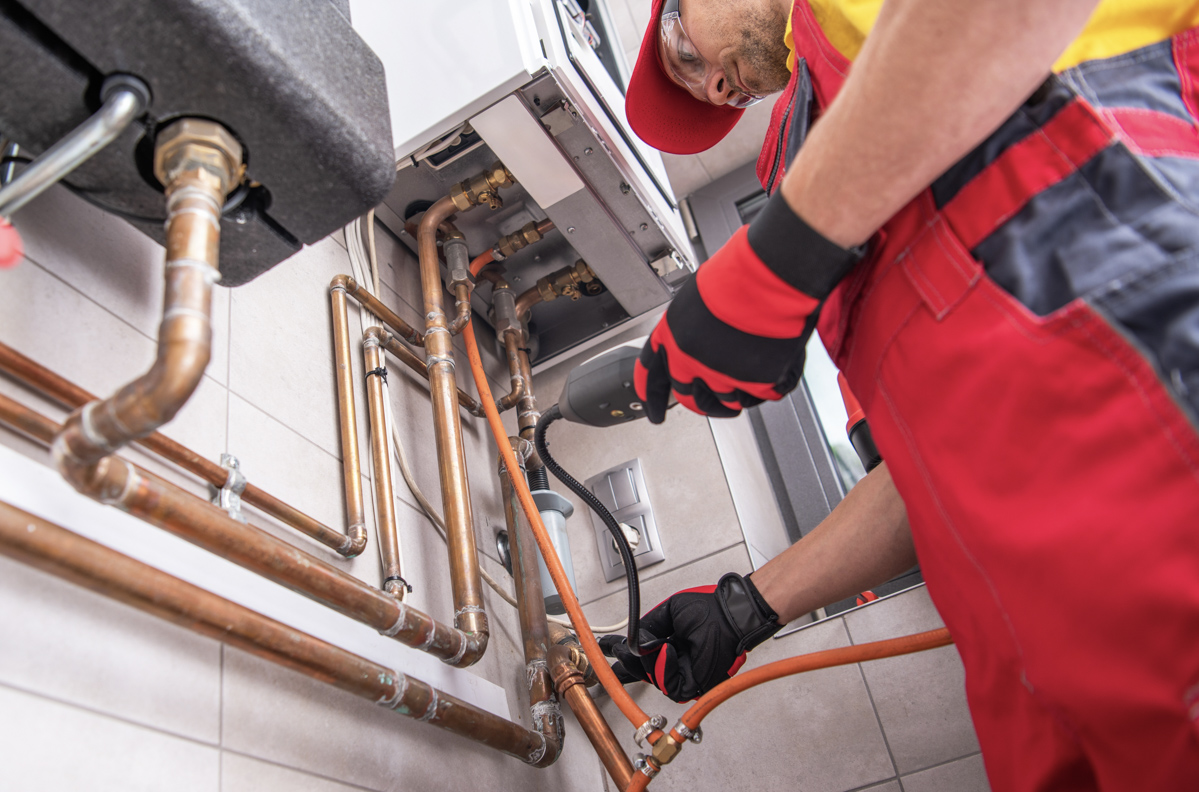 Plumber working on bathroom remodel plumbing timeline