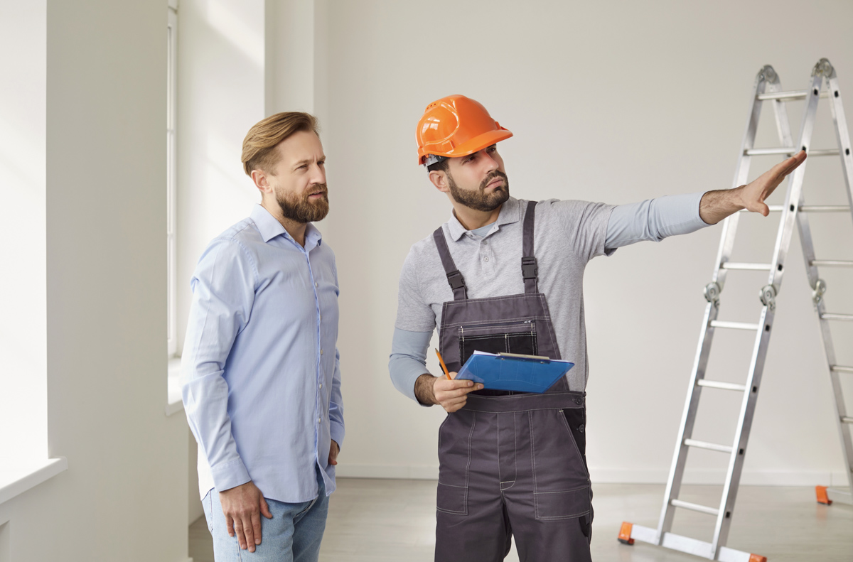 Contractor explains hurricane impact windows vs shutters to homeowner