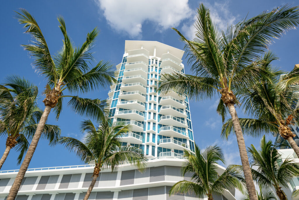 Florida condo milestone inspection high-rise with palm trees
