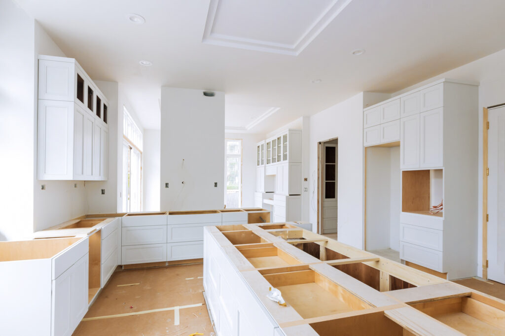 Small kitchen remodel with white cabinets and island installation