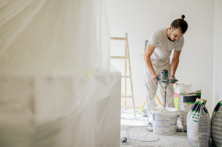 Contractor mixing material during home renovation work