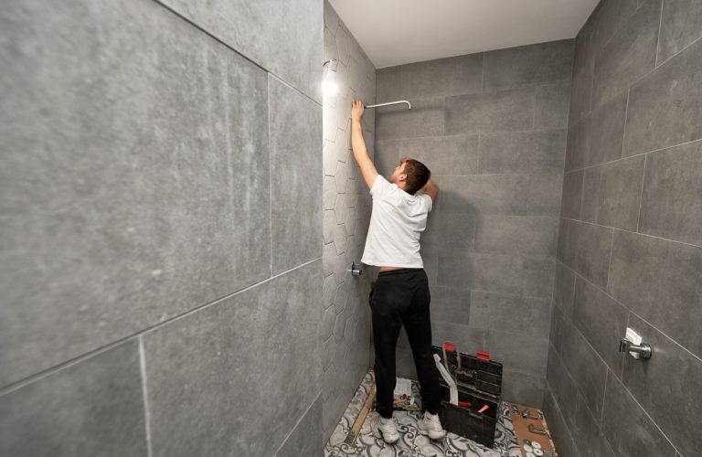 Porcelain shower tile installation in modern bathroom