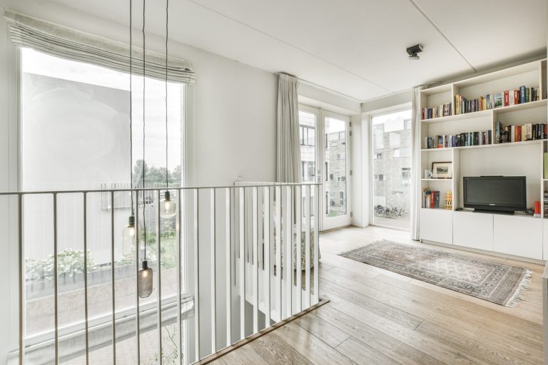 Bright condo remodel with hardwood floors and built-in shelves