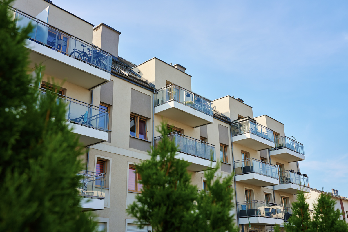 Modern condo building with balconies for condo association insurance coverage