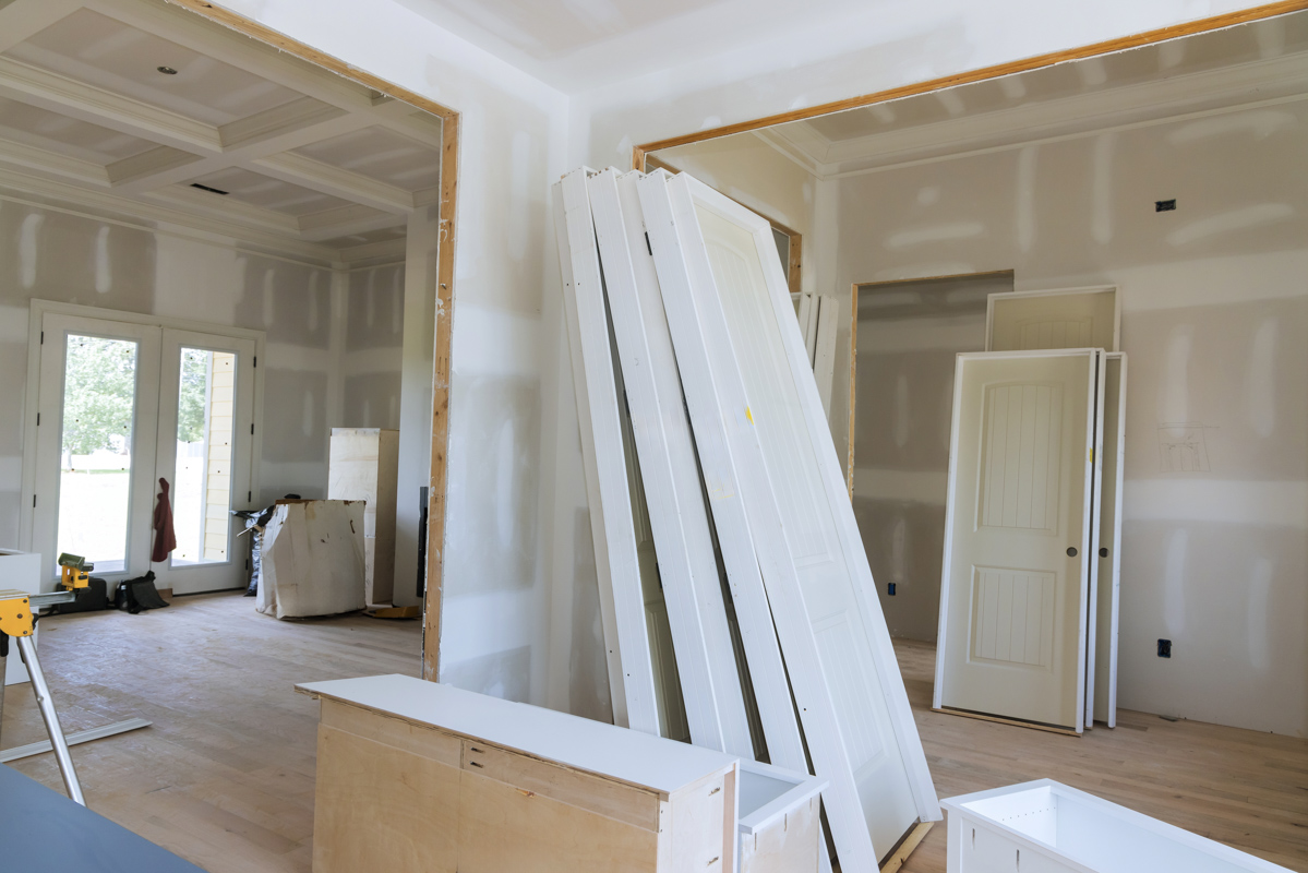 General contractor renovation with drywall and stacked interior doors